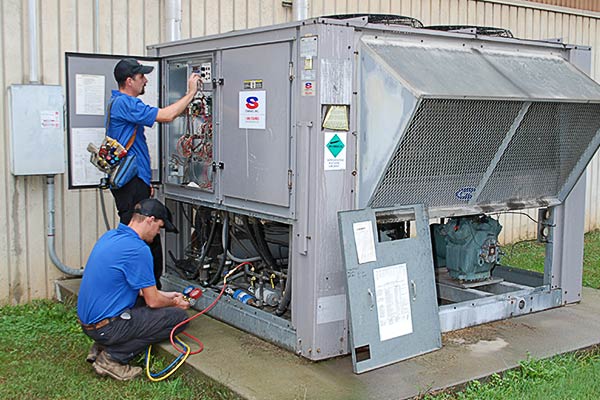 Starnes Service two Starnes technicians servicing system