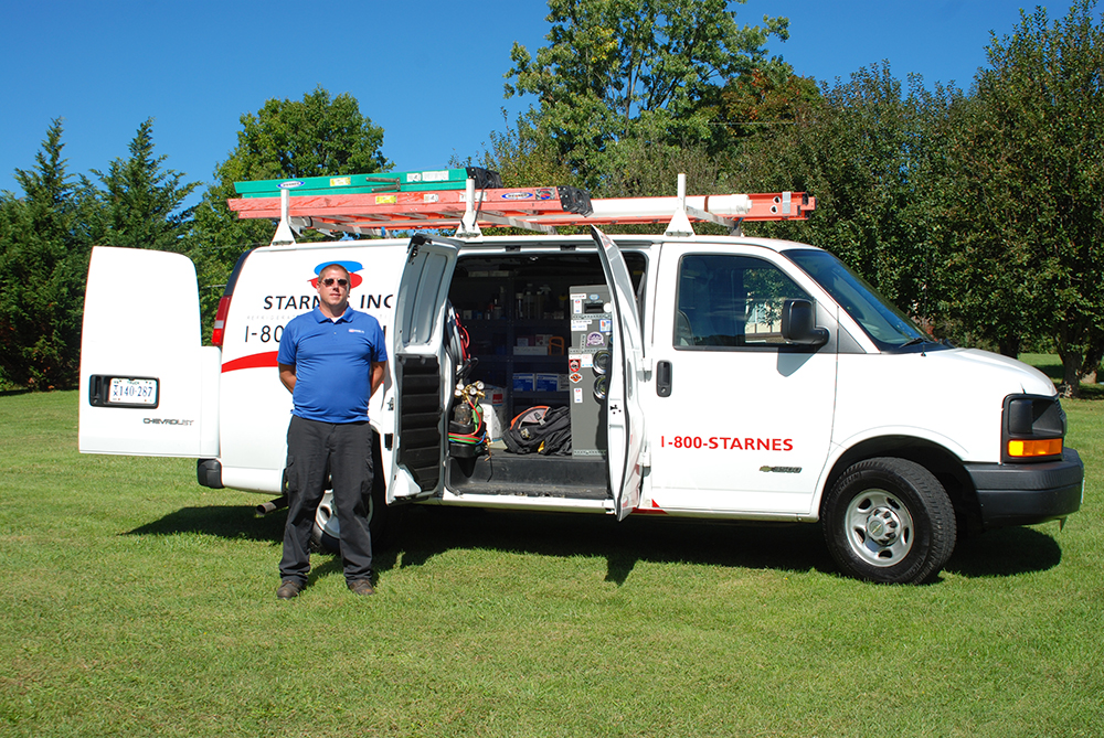 DSC_0216cropped Starnes team member posing with company van doors open